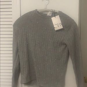 gray long sleeve dressy top.